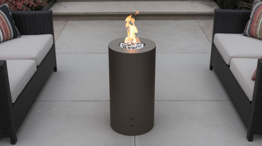 Cylindrical propane fire pit on a modern patio with seating and a soft steady flame.